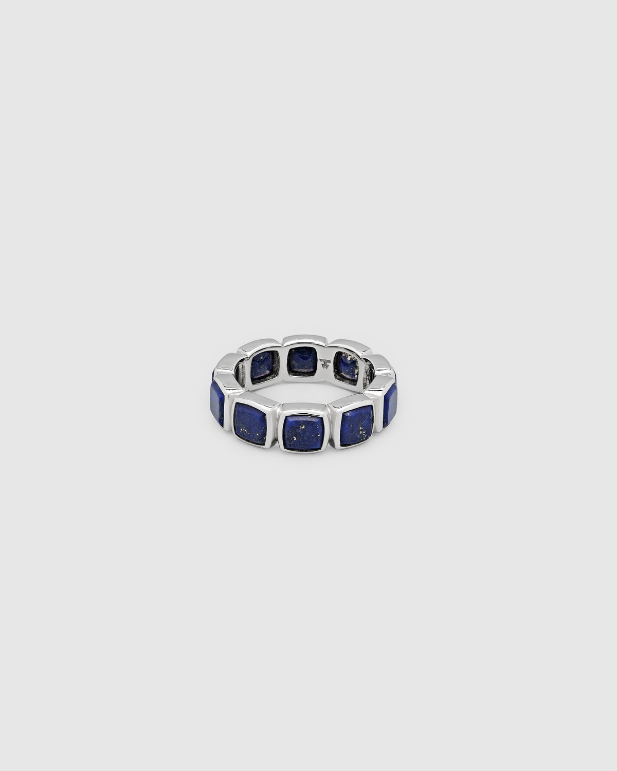 Silver ring with a geometric design on a white background
