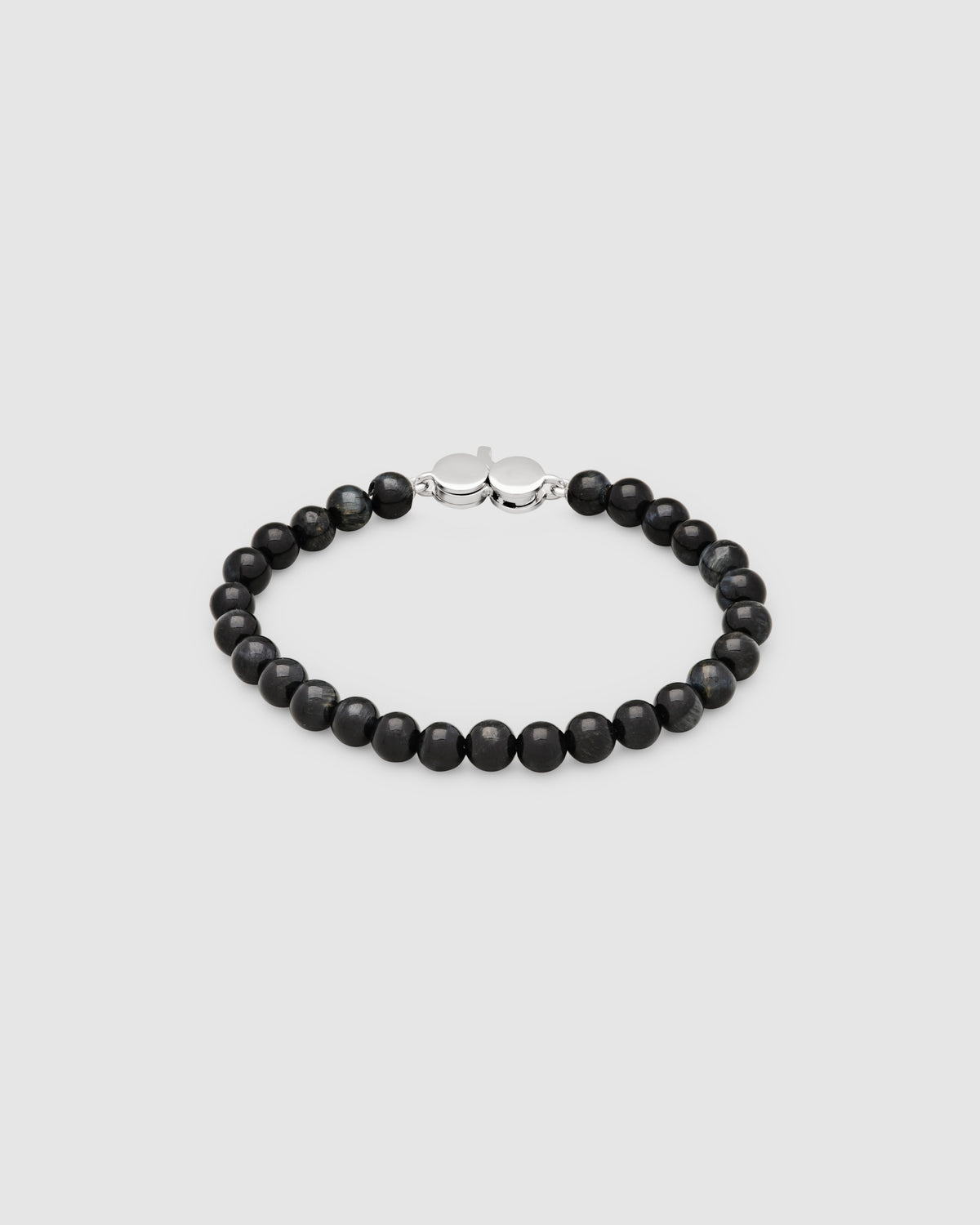 A beaded bracelet made of matte black round beads with a polished silver-toned lobster clasp, displayed on a light gray background.