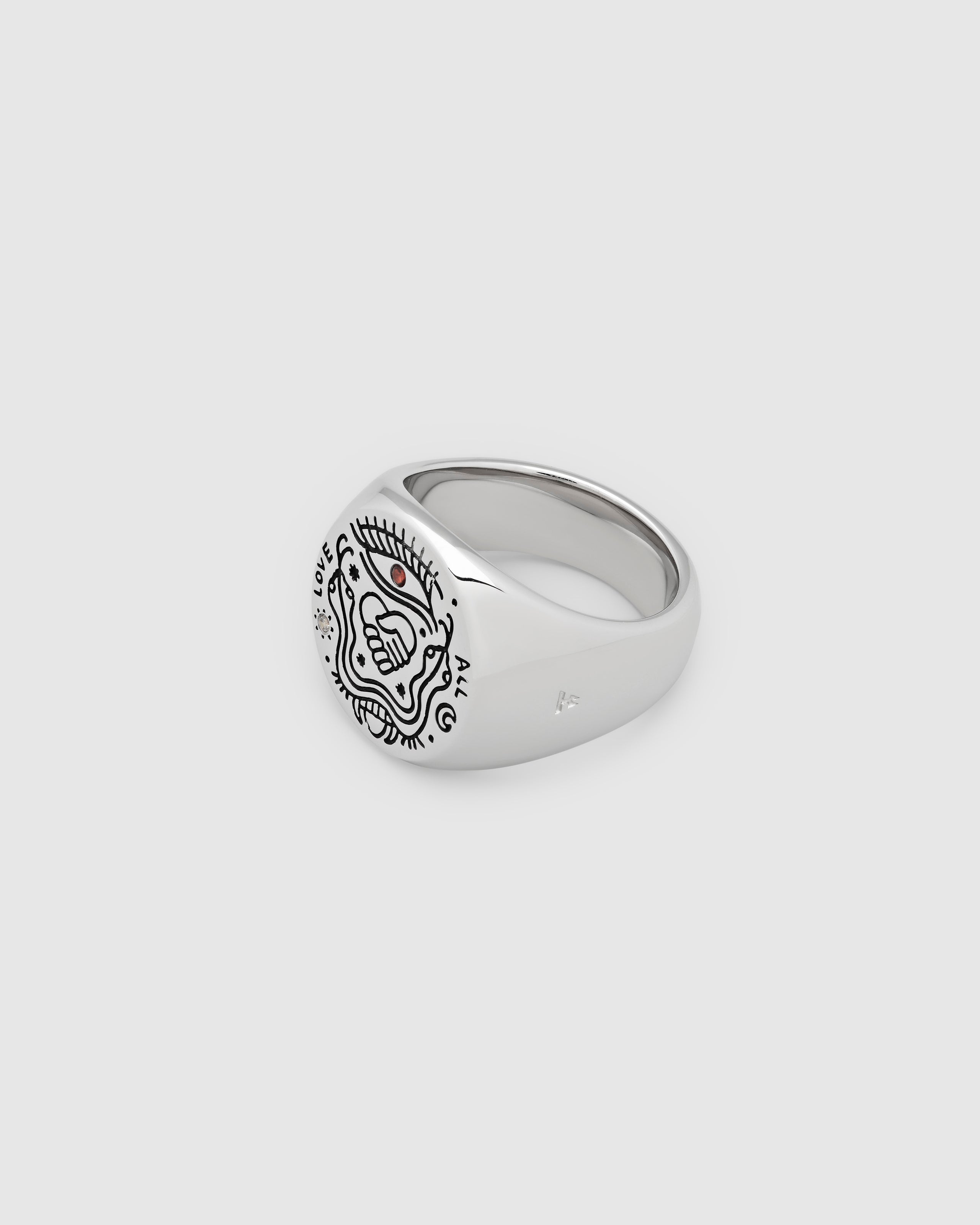 925 sterling silver signet ring with engraved symbols in black antiquing and drawings from Guy Le Tatooer on a white background