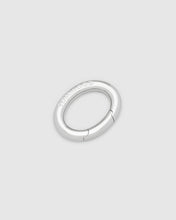 A silver metal oval clasp with a hinged clasp and the brand name 'TOMWOOD' engraved on the side, shown on a light gray background.