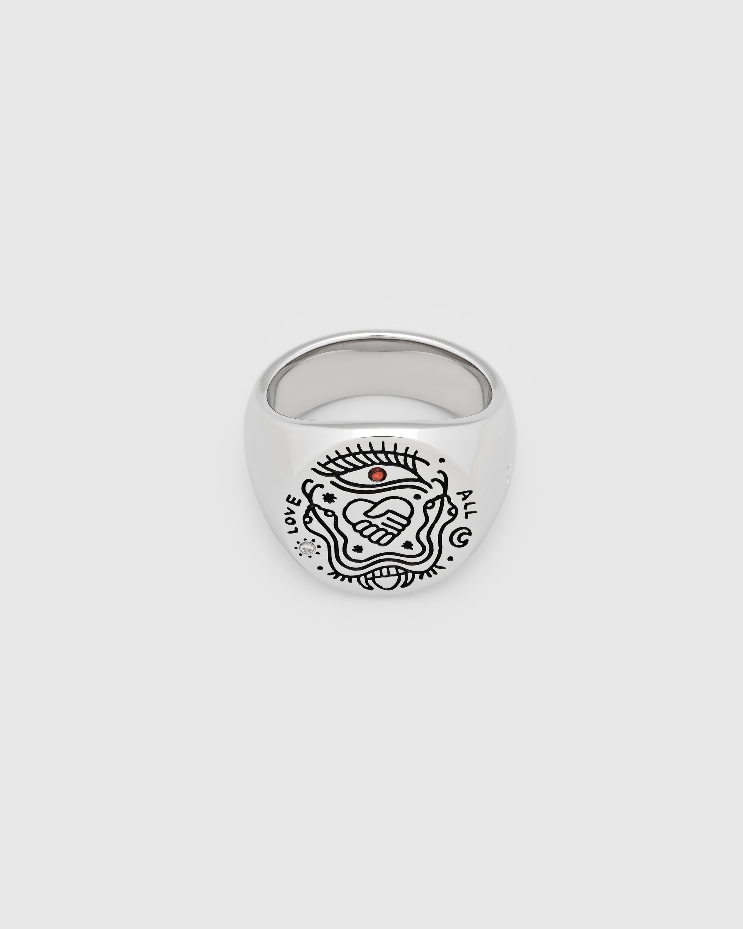925 sterling silver signet ring with engraved symbols in black antiquing and drawings from Guy Le Tatooer on a white background