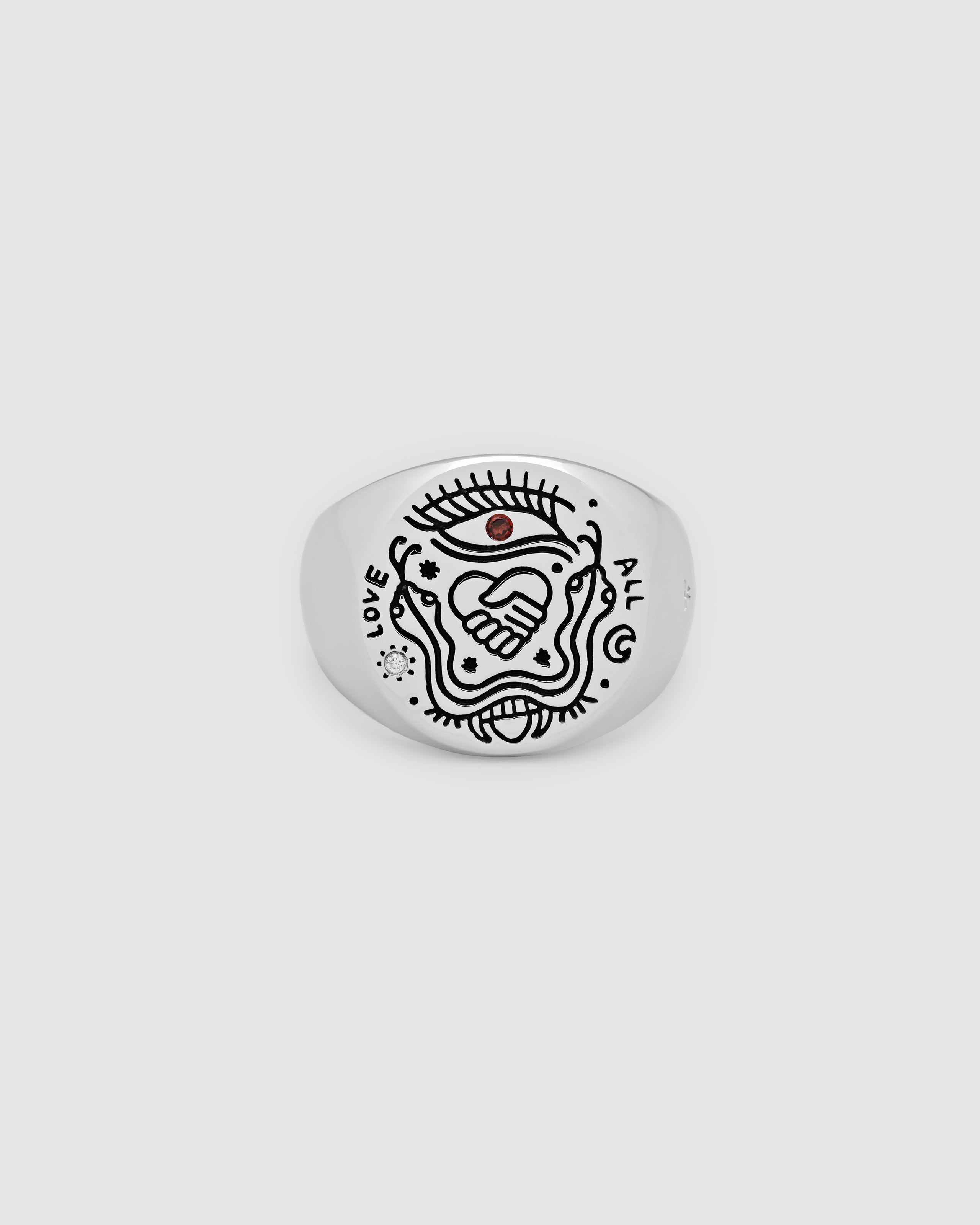 925 sterling silver signet ring with engraved symbols in black antiquing and drawings from Guy Le Tatooer on a white background