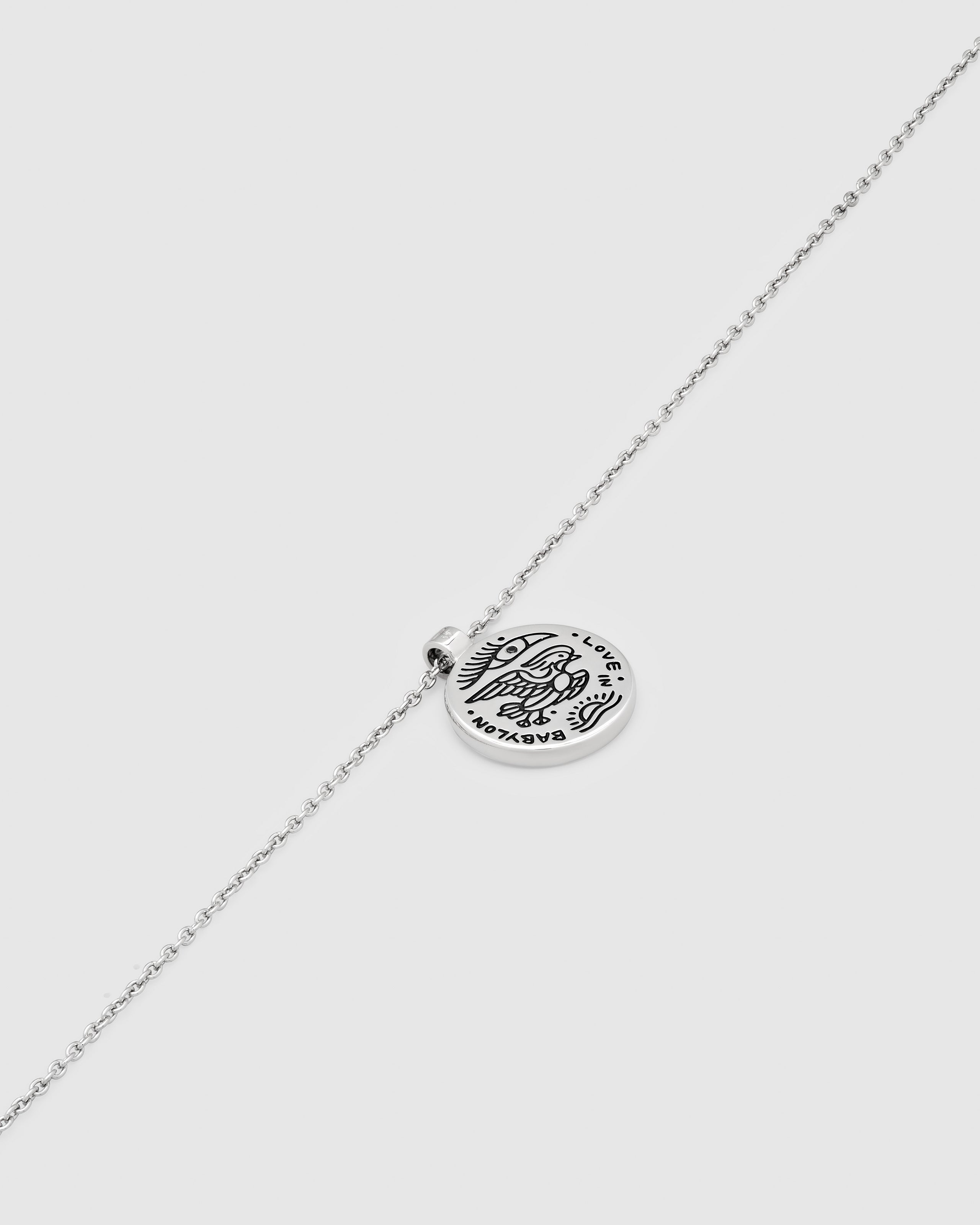 925 sterling Silver necklace with a silver pendant with black antiquing on a white background