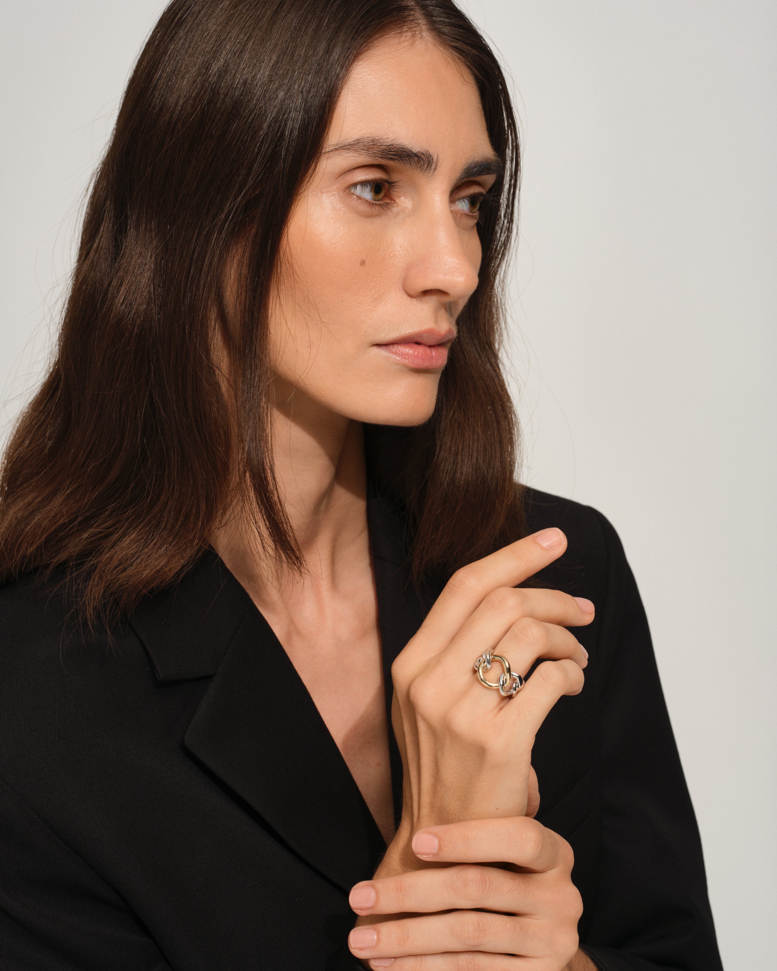Tom Wood sterling silver ring with polished finish and 9k gold on model