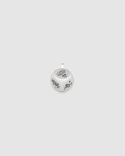 Silver pendant with butterfly design on a light gray background